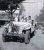 Mitch, Anne Marie & Randy Gariador in 1942 Willys Jeep in backyard of Magnolia house